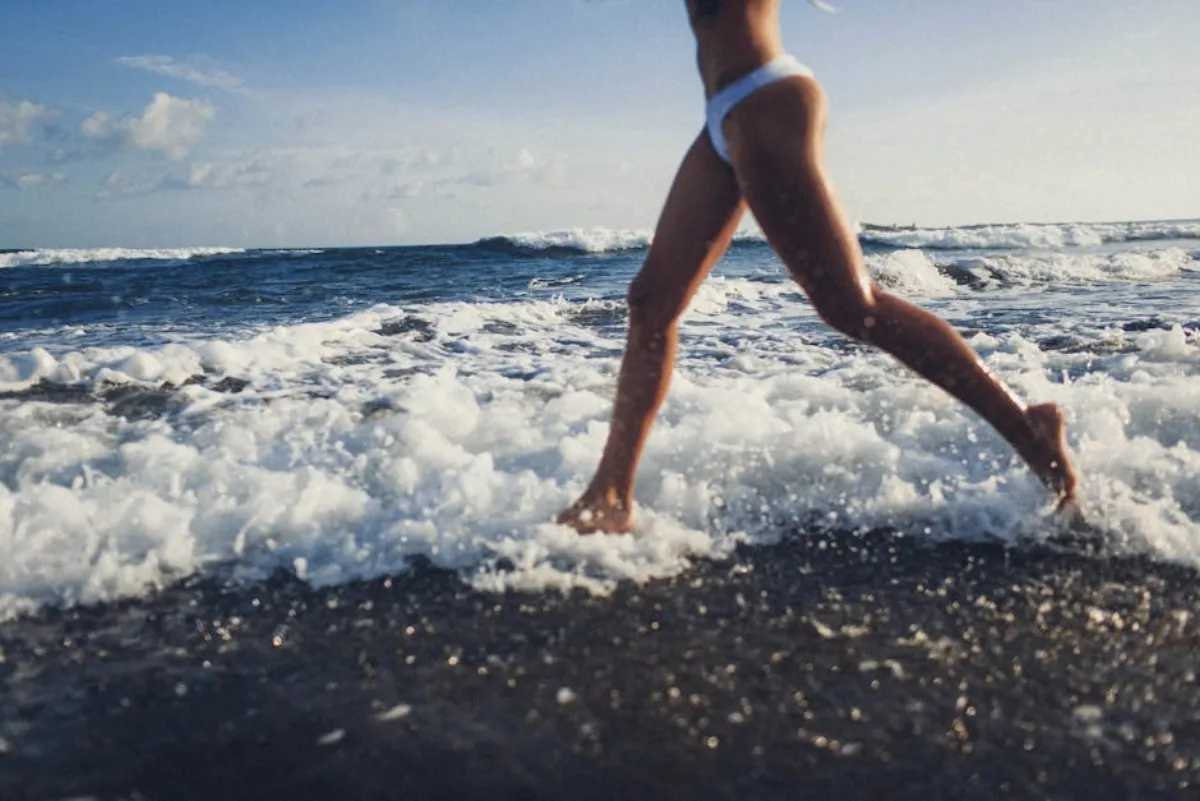 Woman running outdoors, pain-free after treatment