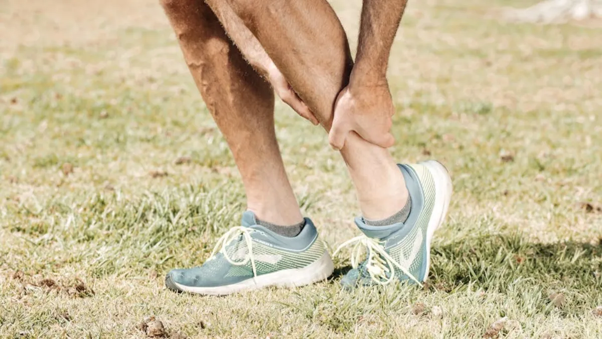Runner holding shin due to medial tibial stress syndrome