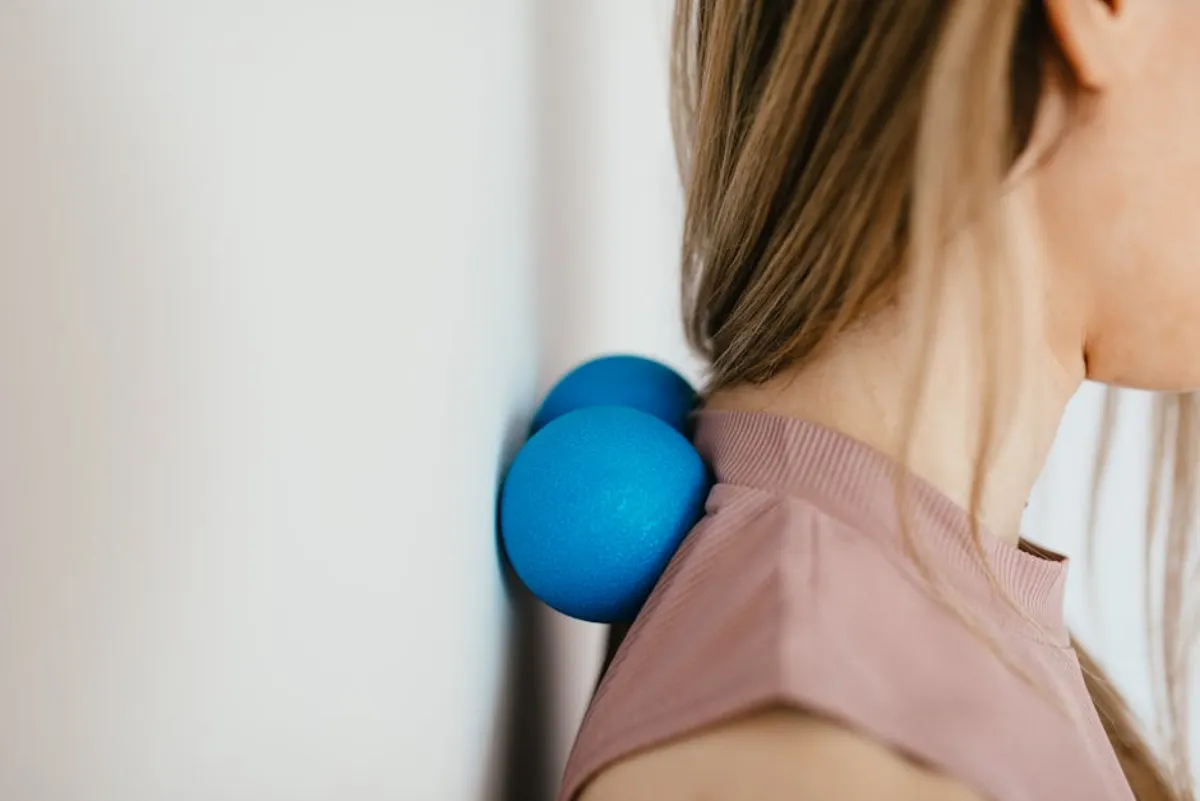 Provider treating a myofascial trigger point in the upper back